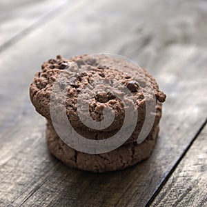 Chocolate chip cookies on wooden background