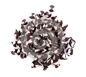 Chocolate chip morsels spread on white background