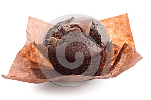 Chocolate chip muffin in brown wax paper. Unwrapped photo