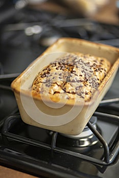 Chocolate Chip Pumpkin Bread in Stoneware Loaf Pan on Stovetop