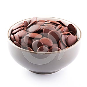 Chocolate chips in a bowl to make chocolate desserts. Side view