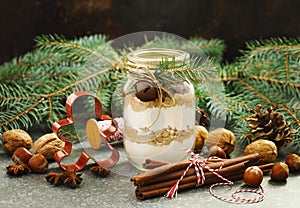 Chocolate chips cookie mix for Christmas gift in jar and ingredients for Christmas baking