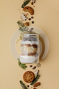 Chocolate chips cookie mix in glass jar for Christmas gift