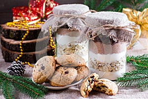 Chocolate chips cookies ingredients in a glass jar