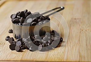 Chocolate Chips on a Wooden Cutting Board