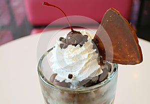 Chocolate Coated Maraschino Cherry Topped on Ice Cream Sundae Whipped Cream