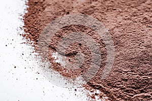 Chocolate cocoa milk powder on a white background