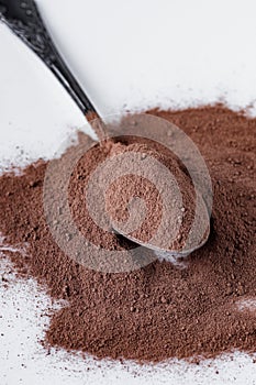 Chocolate cocoa milk powder on a white background