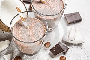 Chocolate coconut hazelnut milkshake or smoothie close up.