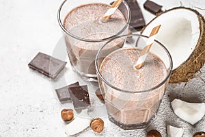 Chocolate coconut hazelnut milkshake or smoothie top view.