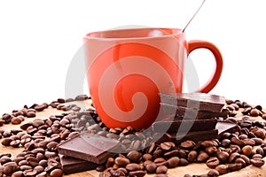 Chocolate, coffee beans and cup