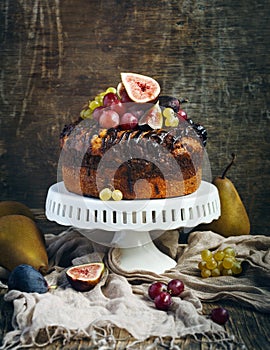 Chocolate coffee cake decorated with fresh fruits