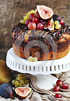 Chocolate coffee cake decorated with fresh fruits