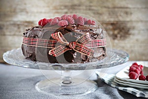 Chocolate coffee raspberry cake with creamy ganache and ribbon