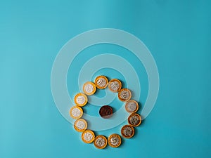 Chocolate coins on celestial background