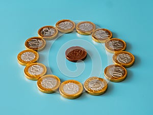 Chocolate coins on celestial background