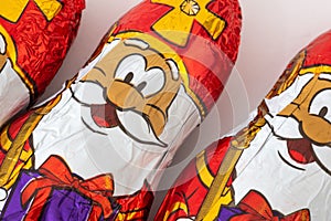 Chocolate coins, ginger nuts and a chocolate Saint Nicolas, typical candy for children at Sinterklaas feest, a dutch party for chi