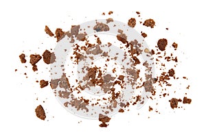 Chocolate cookie crumbs on a white background.