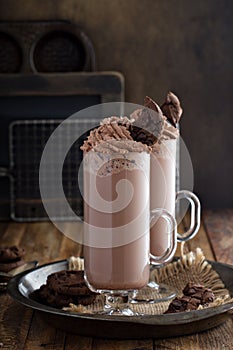 Chocolate cookie milkshake in tall mugs