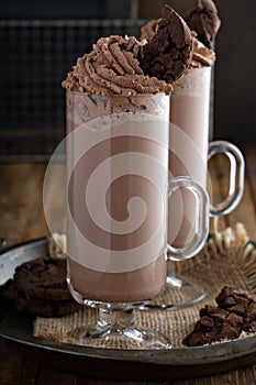 Chocolate cookie milkshake in tall mugs