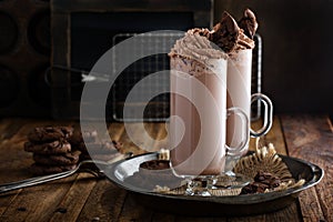 Chocolate cookie milkshake in tall mugs