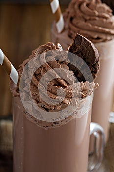 Chocolate cookie milkshake in tall mugs