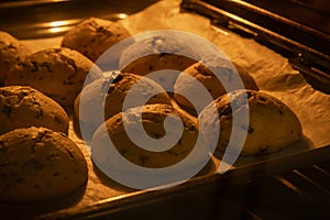 Chocolate cookies are baked in the oven. delicious cookies for tea are prepared at home by the housewives.