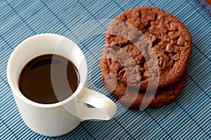 Chocolate cookies and coffee cup