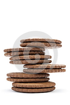 Chocolate cookies with cream filling on white background