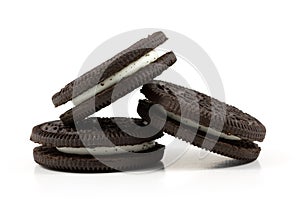 Chocolate cookies with cream filling on white background