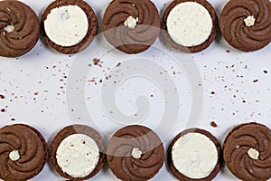 Chocolate cookies with cream filling on a white background with copy space