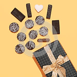 Chocolate cookies mix and gift box. Sweets present lover concept. Minimal art. Holidays party time, winter christmas celebration