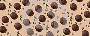 Chocolate Cookies pattern on the beige pastel background with mint and pieces of natural chocolate. Top view of chocolate chip