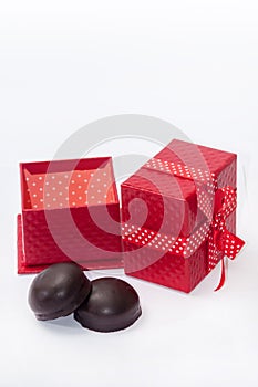 Chocolate cookies with red gift box with bow