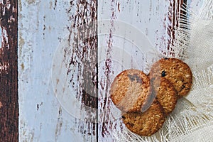 Chocolate cookies on rustic wooden table. Space for text. View top.