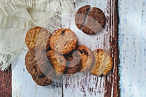 Chocolate cookies on rustic wooden table. Space for text. View top.