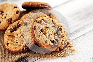 Chocolate cookies on wooden table. Chocolate chip cookies shot on wooden white table