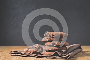 Chocolate cookies on wooden table/Chocolate cookies on wooden table on a dark background with copy space