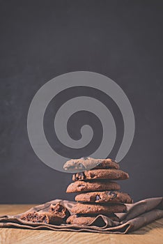 Chocolate cookies on wooden table /Chocolate cookies on wooden table on a dark background. Selective focus