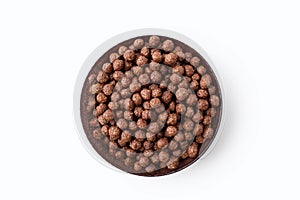 Chocolate corn flakes in a bowl on a white isolated background in the center of the image