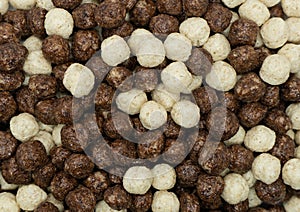 Chocolate corn flakes teture background. Chocolate puff cereal background. Macro shot