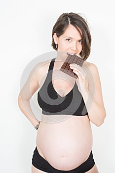a chocolate craving for a pregnant woman enjoying of eating