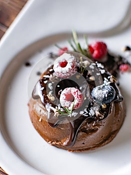 Chocolate cream mousse cake with fresh berries. delicious dessert.