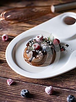Chocolate cream mousse cake with fresh berries. delicious dessert