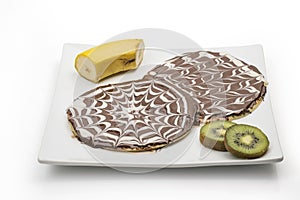 Chocolate crepe, Chocolate pancake with banana and kiwi isolated on white background