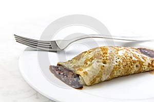 Chocolate crepe on dish