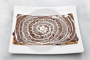 Chocolate crepe isolated on white background