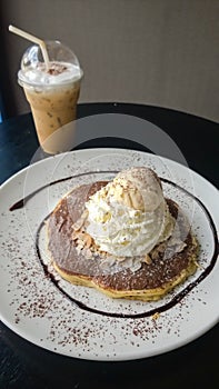 Chocolate crepe served with ice cream and whipping cream at coffee cafe