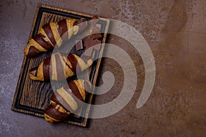 Chocolate croissant and chocolatier on table photo