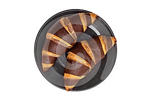 Chocolate croissants in a plate isolated on a white background, top view